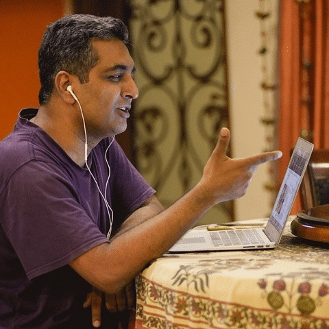 man teaching via laptop | online teaching jobs | Peace Evolution