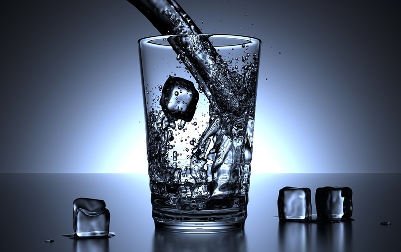 glass being filled with water and ice | health and weight loss | Peace Evolution